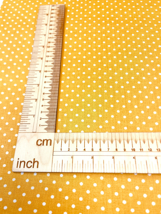 100% Cotton fabric - dots (4 mm) on a mustard yellow background 125 g/m²
