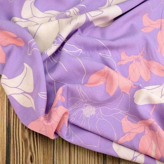 100% viscose fabric- flowers on a lilac background 105 g/m²
