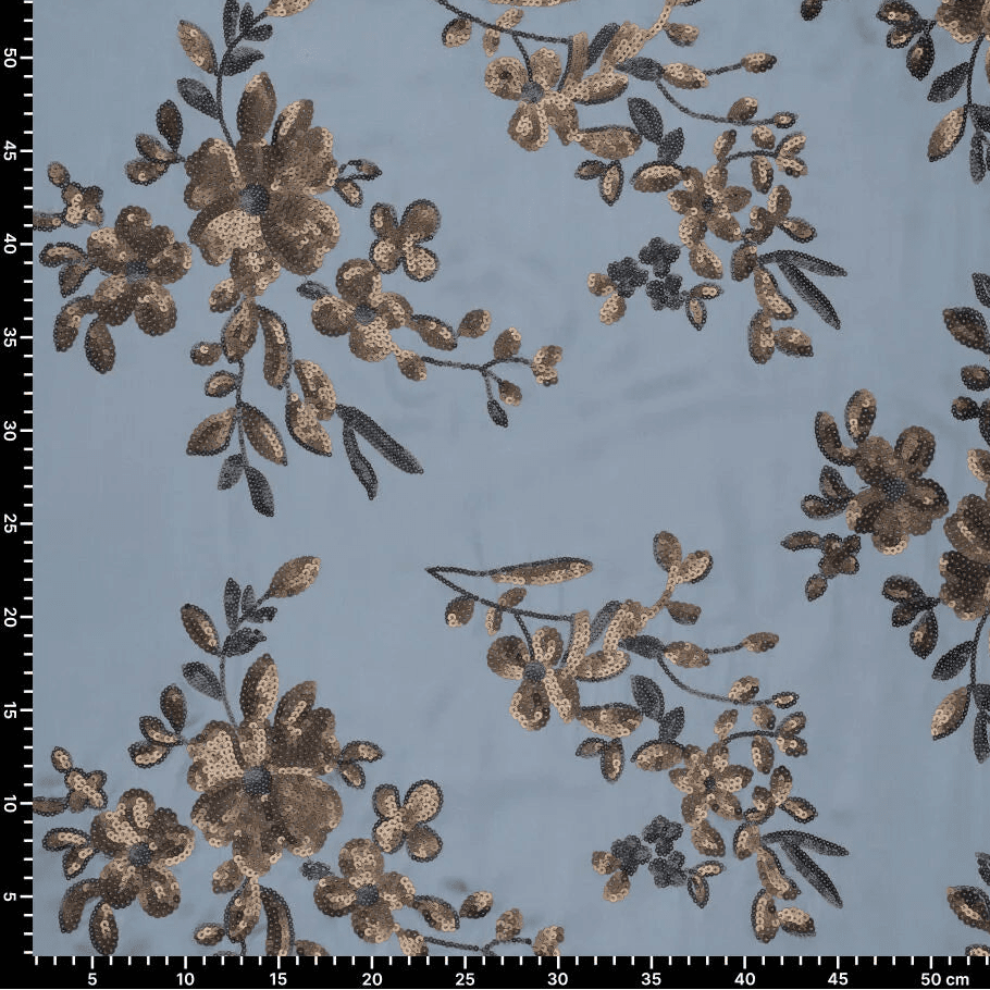 Image d'un tissu satiné souple avec broderies florales et sequins bleus, noirs et dorés – disponible en ligne chez Charlotte's Fabrics