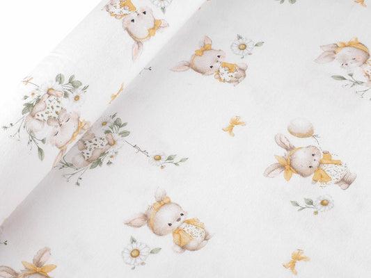 Image of cotton flannel with bunnies in yellow bows – 100% cotton – available online at Šarlotes audumi