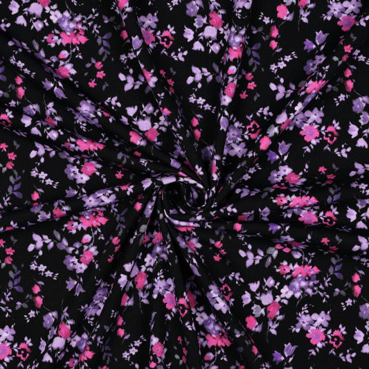 Cotton jersey fabric with small lilac flowers – available online at Charlotte's Fabrics