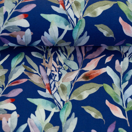 Cotton jersey - leaves on a blue background 200 g/m²