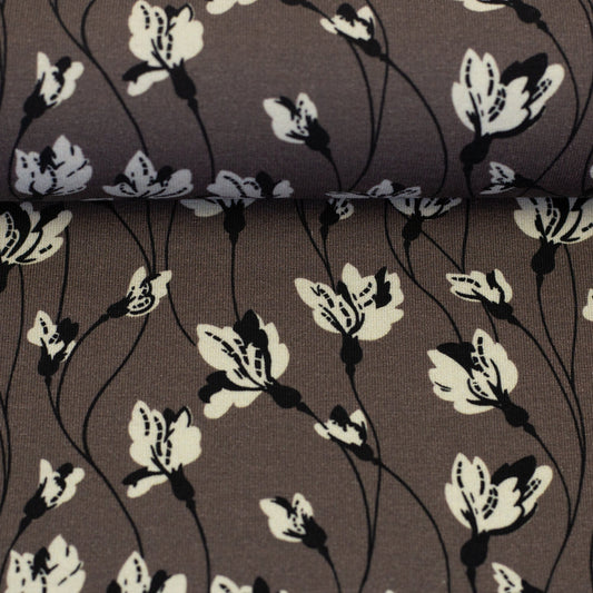 Image avec motif floral en jersey de coton sur fond brun grisâtre 210 g/m² – disponible en ligne chez Šarlotes audumi