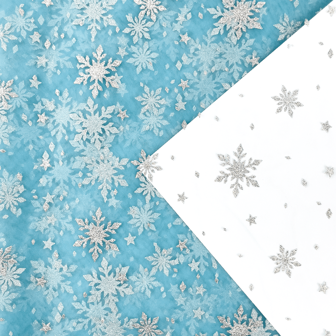 Image of soft tulle with silver snowflakes - blue 30 g/m² – available at Šarlotes audumi