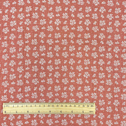 muslin - white flowers on an orange background 130 g/m²