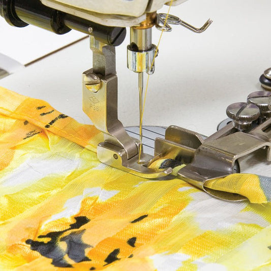 Image of an industrial sewing machine presser foot - hemmers and binder attachments, 7 mm – available at Charlotte Fabrics