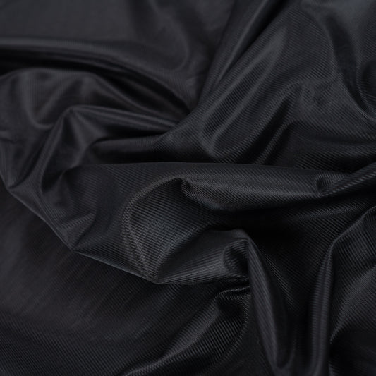 Image of black knitted lining fabric – available online at Šarlotes audumi