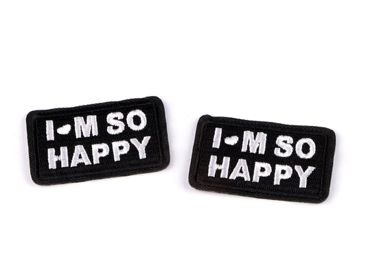 Iron-on applique “I’M SO HAPPY” – 3 × 5 cm – available online at Šarlotes audumi