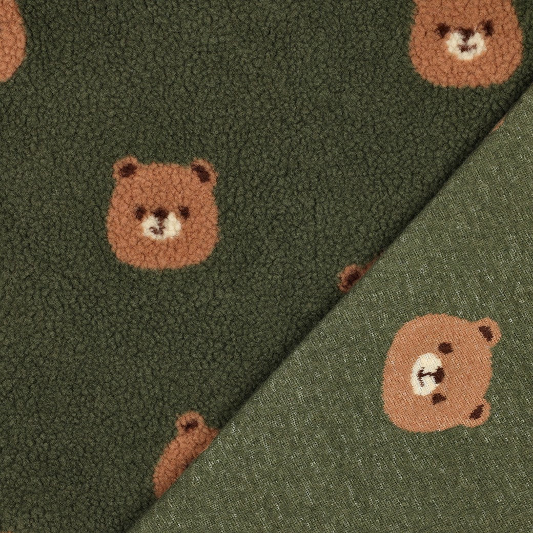 Teddy fleece bears on dark green