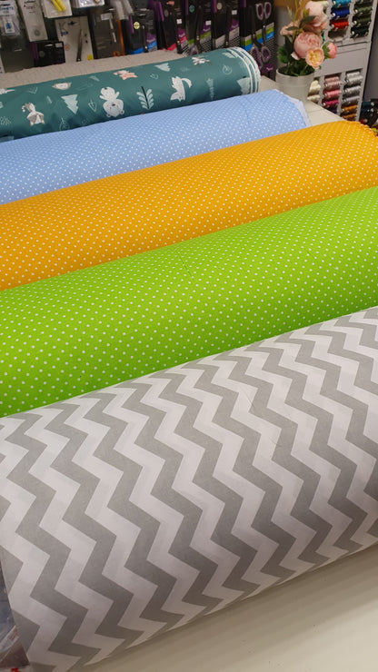 100% Cotton fabric - white polka dots on a green background (4 mm) 130 g/m²