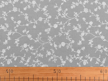Image with 100% cotton fabric - white floral vines on dark blue 125 g/m² – available at Charlotte Fabrics