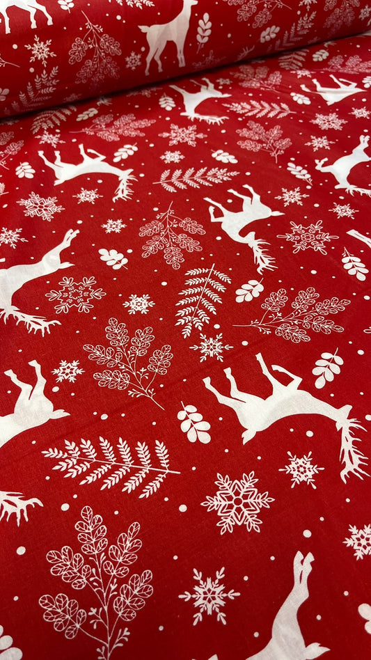 image with 100% cotton fabric - white deer on a red background - available online at Charlotte Fabrics