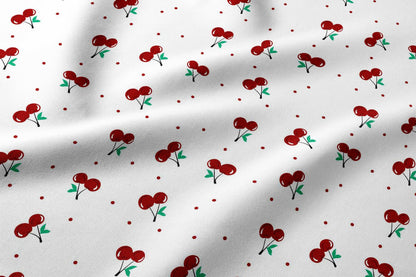 Image du tissu en coton 100 % à cerises – disponible en ligne chez Šarlotes audumi