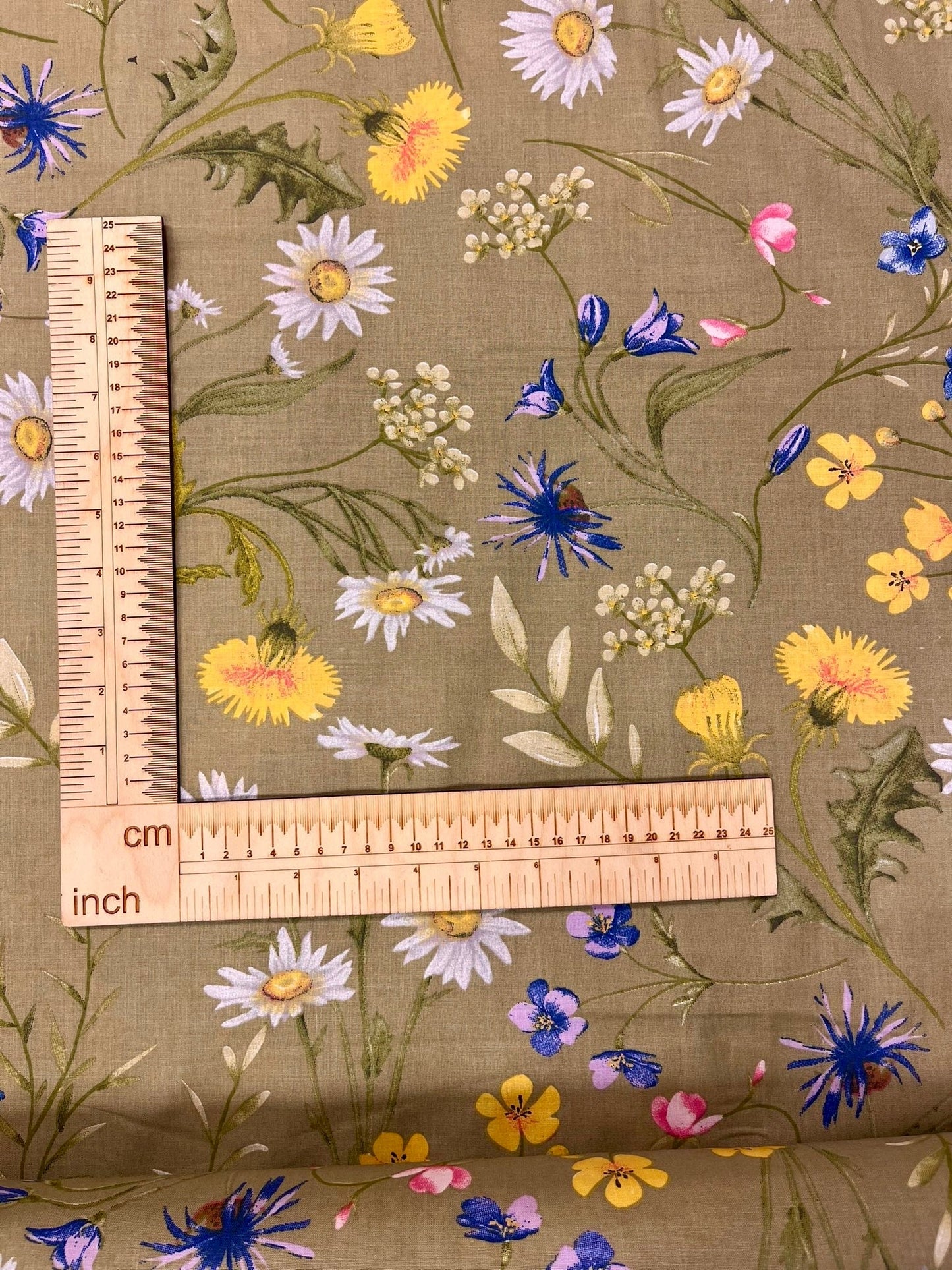 Image with 100% cotton fabric - meadow flowers on a green background 125 g/m² – available at Šarlotes audumi