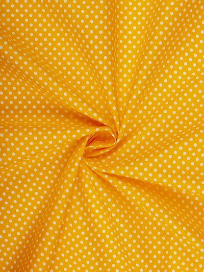 100% Cotton fabric - dots (4 mm) on a mustard yellow background 125 g/m²