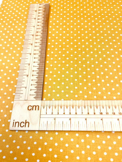 100% Cotton fabric - dots (4 mm) on a mustard yellow background 125 g/m²