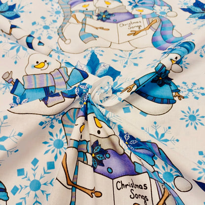 100% Cotton fabric - snowman with a blue hat on a white background 130 g/m²