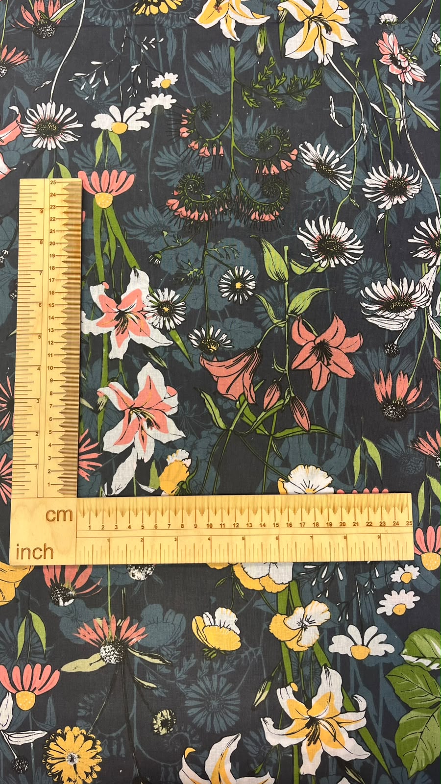 Image of 100% cotton fabric with flowers on a dark background – available online Charlotte's Fabrics