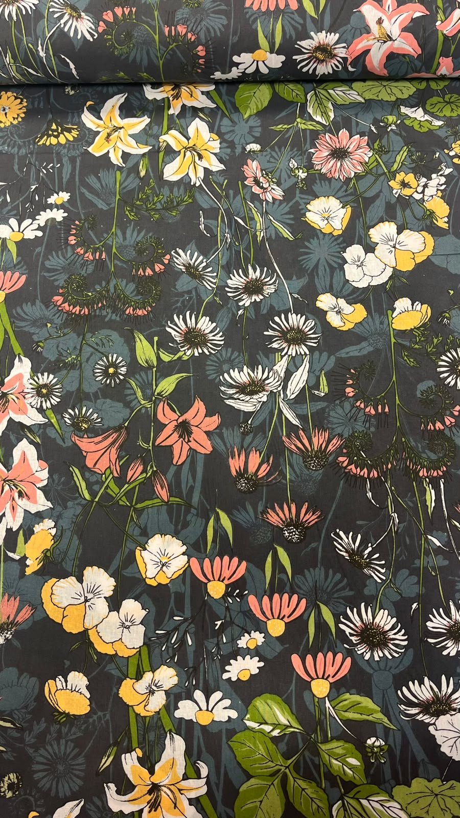 Image of 100% cotton fabric with flowers on a dark background – available online Charlotte's Fabrics