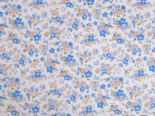 Image of 100% cotton fabric with small blue flowers – available online at Šarlotes audumi
