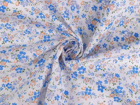 Image of 100% cotton fabric with small blue flowers – available online at Šarlotes audumi