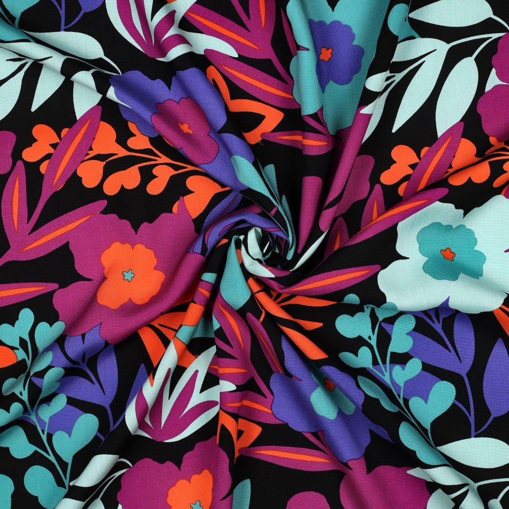 Image of 100% viscose LENZING™ ECOVERO™ fabric with flowers in petrol shades – available online at Šarlotes audumi