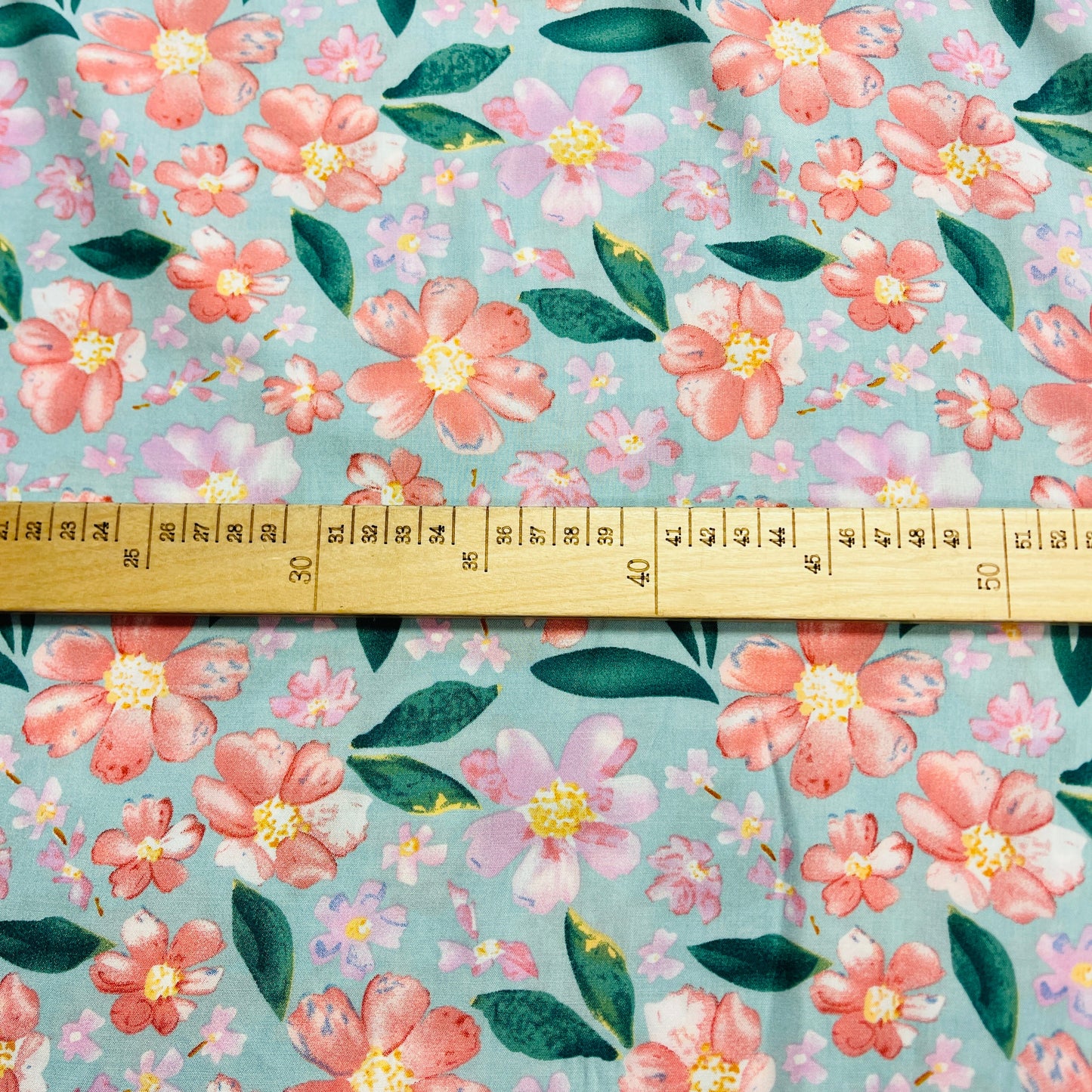 Image of 100% viscose fabric - flowers on a mint background 135 g/m² – available at Šarlotes audumi