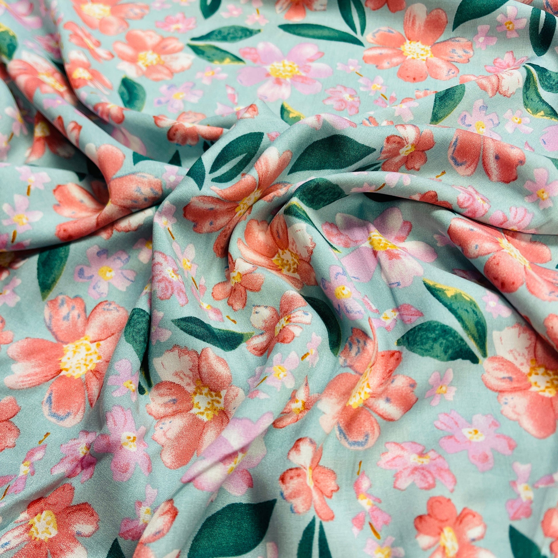 Image of 100% viscose fabric - flowers on a mint background 135 g/m² – available at Šarlotes audumi
