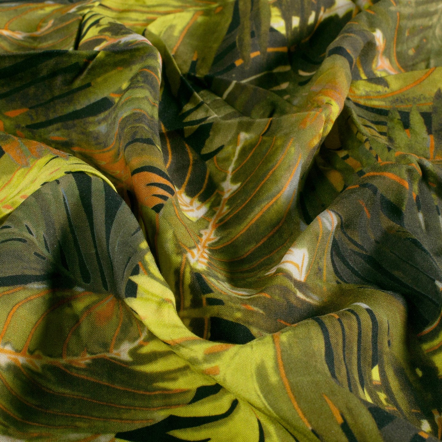 Image with 100% viscose fabric - green tropical leaves 125 g/m² – available at Šarlotes audumi