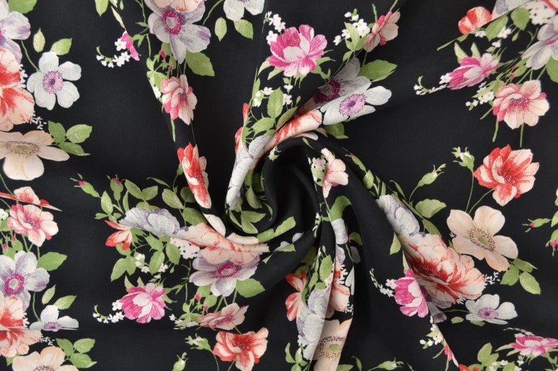 Image with 100% viscose fabric, flowers on black, 100 g/m² – available at Šarlotes audumi