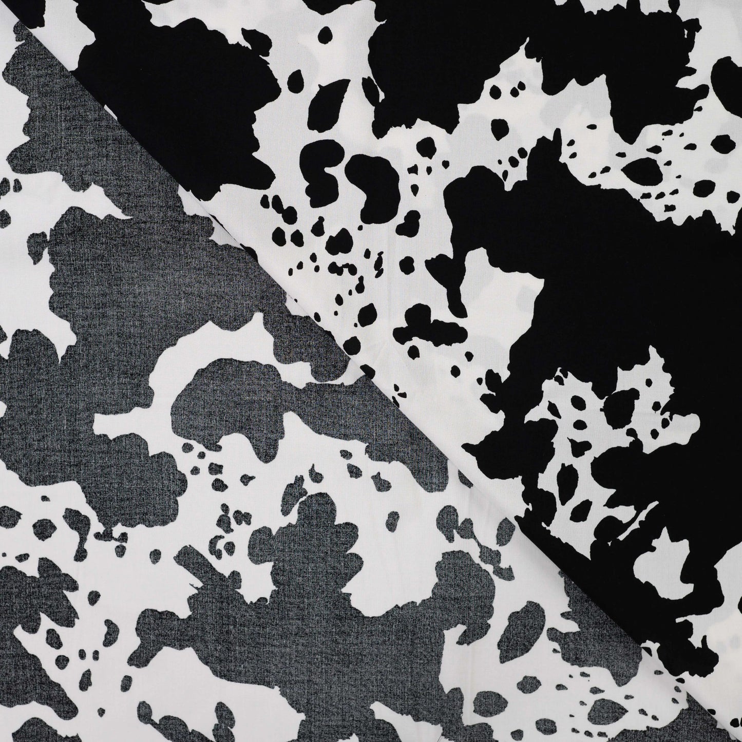 Image with 100% viscose satin - Dalmatian pattern 105 g/m² – available at Šarlotes audumi