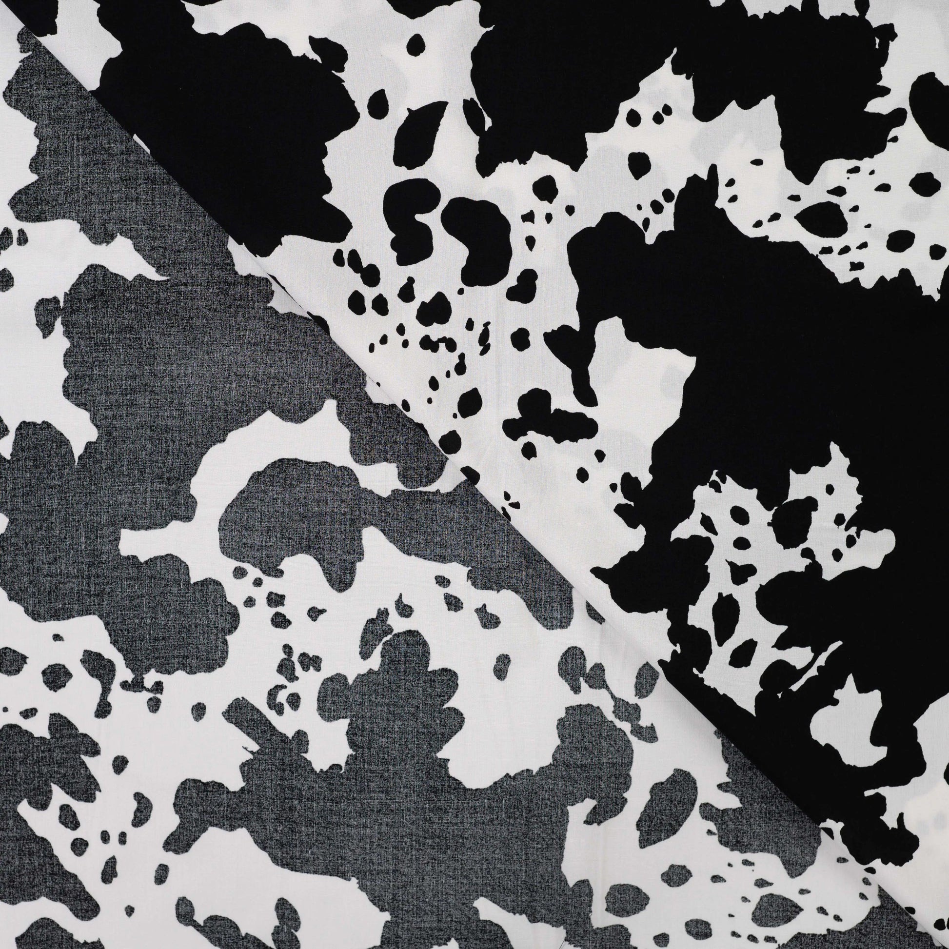 Image with 100% viscose satin - Dalmatian pattern 105 g/m² – available at Šarlotes audumi