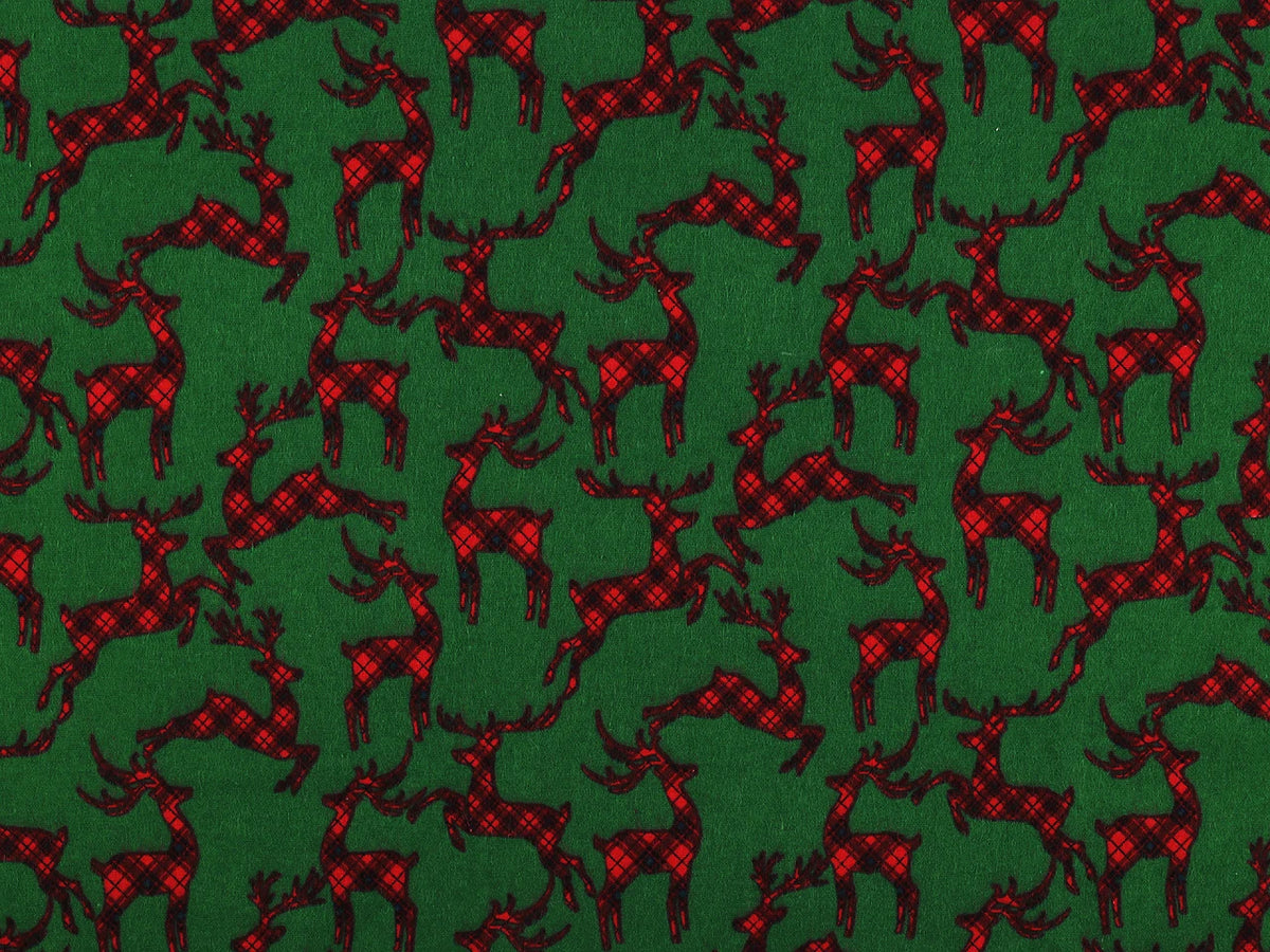 Christmas cotton flannel with reindeer on green