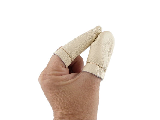 Image of leather finger guards for felting – available online at Šarlotes audumi