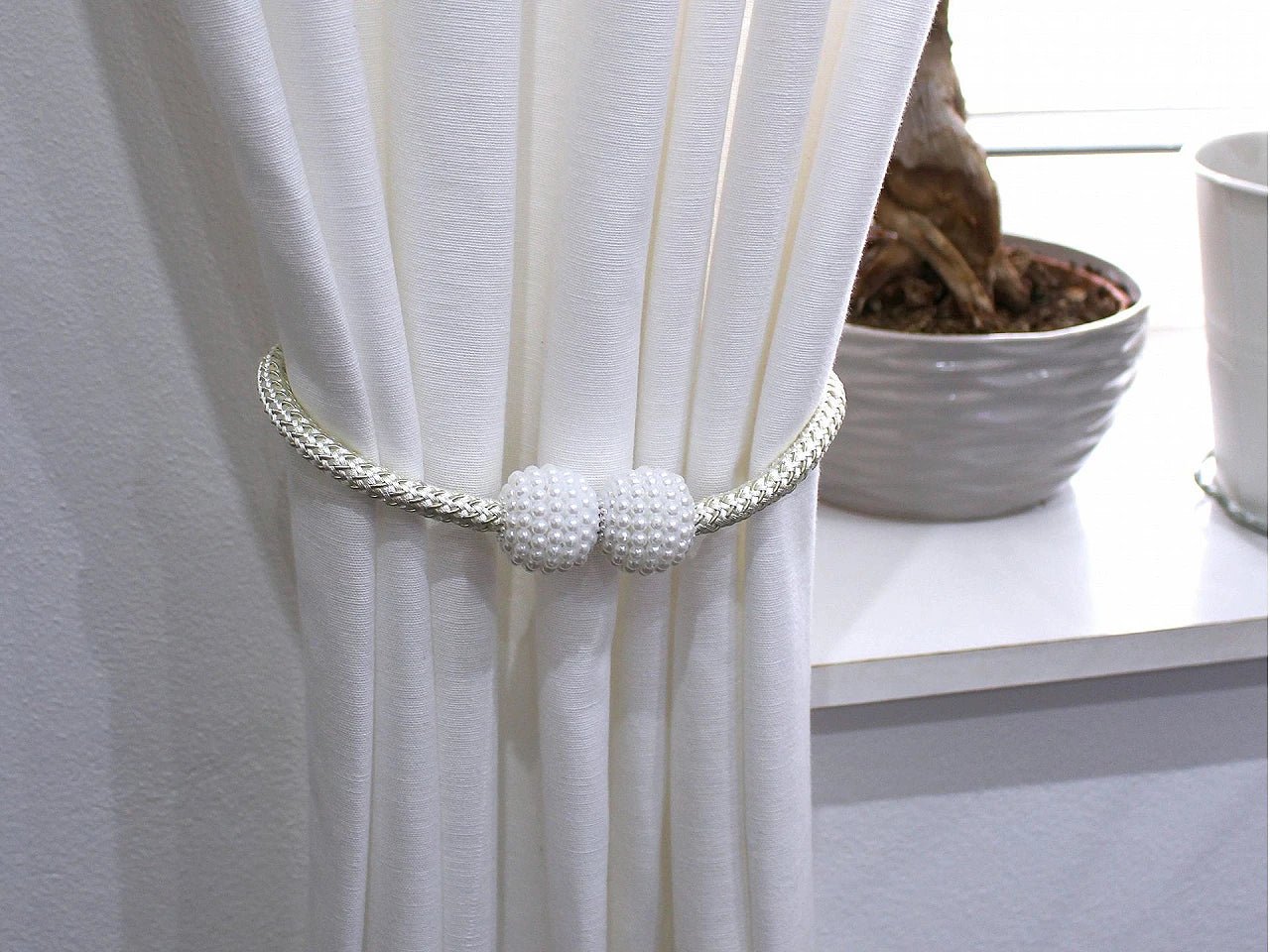 Image with curtain holders with magnet (2 pcs per set)|available in different shades – available at Charlotte fabrics