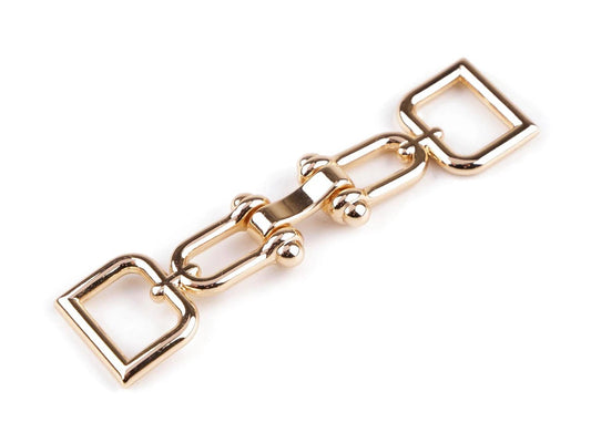 Image of decorative strap fastener, 15 mm – available online at Charlotte Fabrics