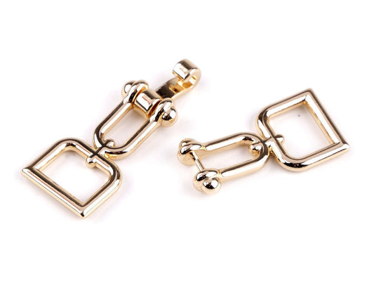 Image of decorative strap fastener, 15 mm – available online at Charlotte Fabrics