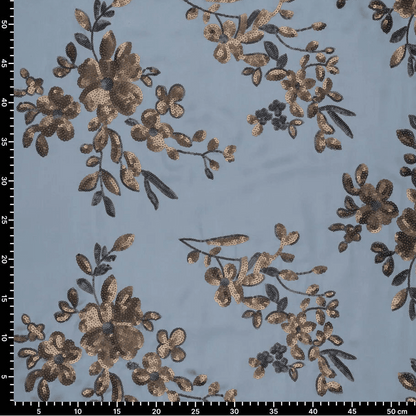 Image d'un tissu satiné souple avec broderies florales et sequins bleus, noirs et dorés – disponible en ligne chez Charlotte's Fabrics