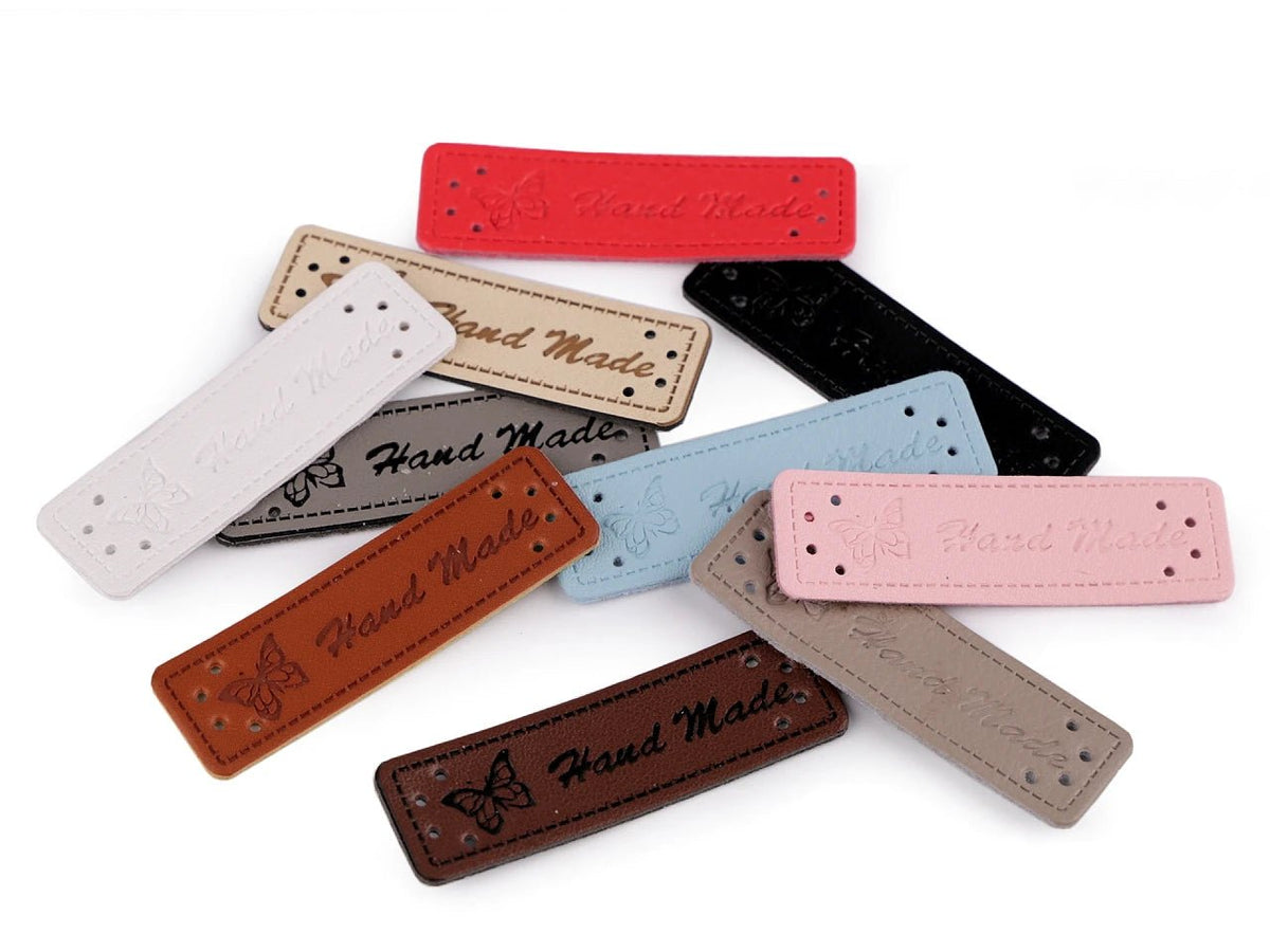 Image of white Handmade labels, 15x50 mm – available online at Šarlotes audumi