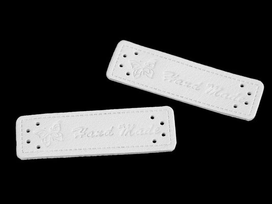 Image of white Handmade labels, 15x50 mm – available online at Šarlotes audumi