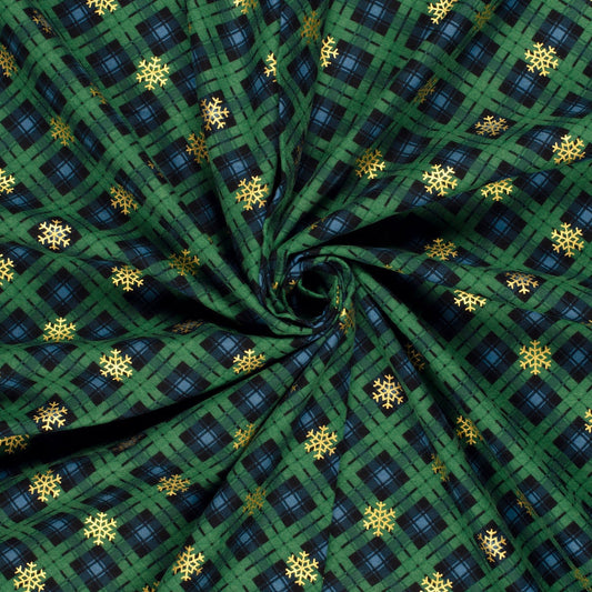 Image du tissu Charlotte en flanelle vert à carreaux avec flocons de neige, disponible en ligne