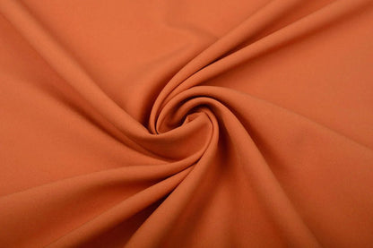 Gabardine orange disponible en ligne chez Šarlotes audumi