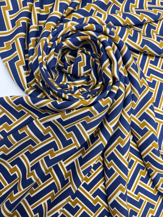 Attēls ar Itālijas 100% viskozes audums brūni zils ar abstraktu rakstu 150 g/m2 – pieejams Šarlotes audumi