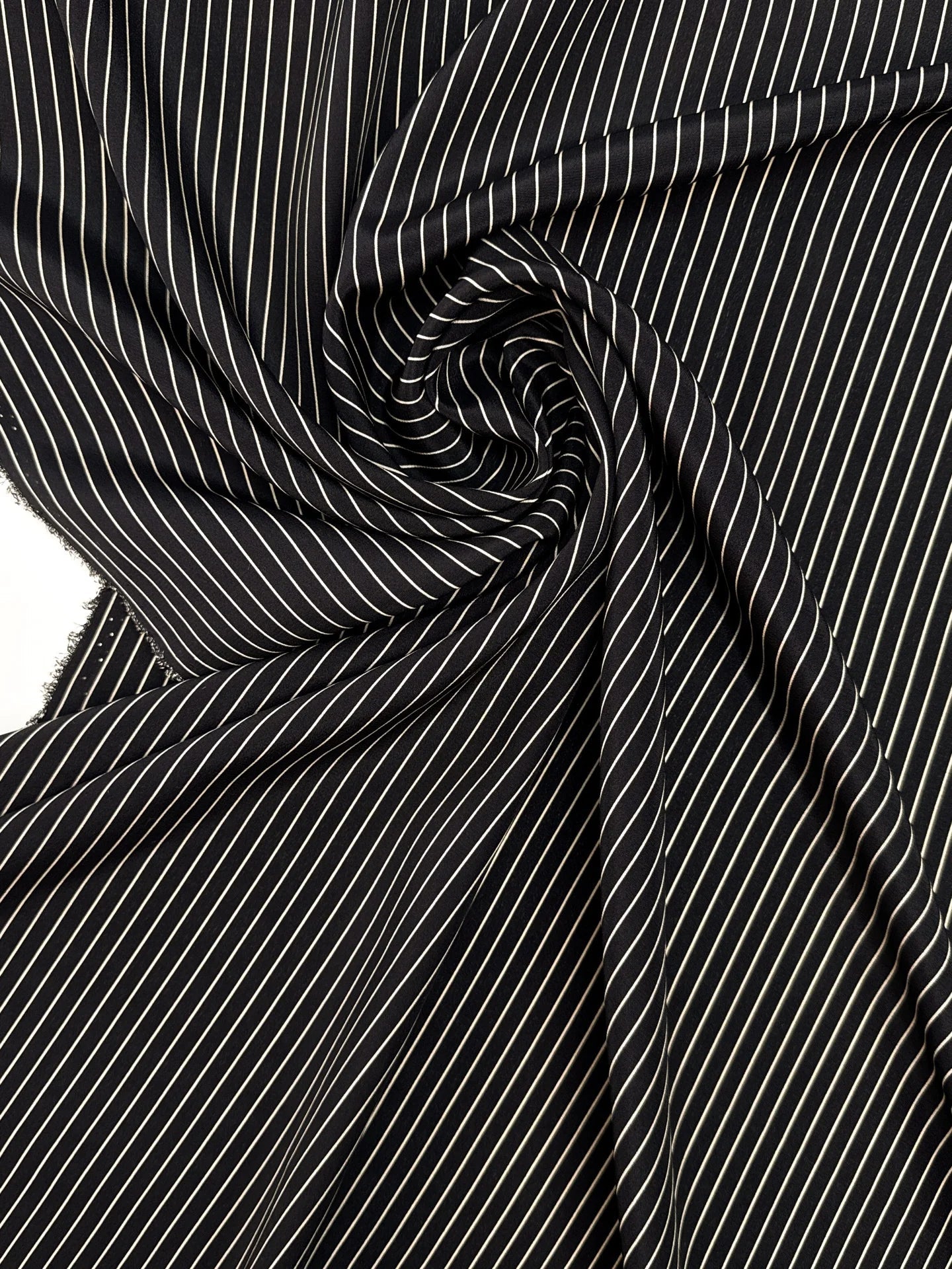 Image of 100% Italian silk fabric with a fine black striped pattern – available online at Šarlotes audumi