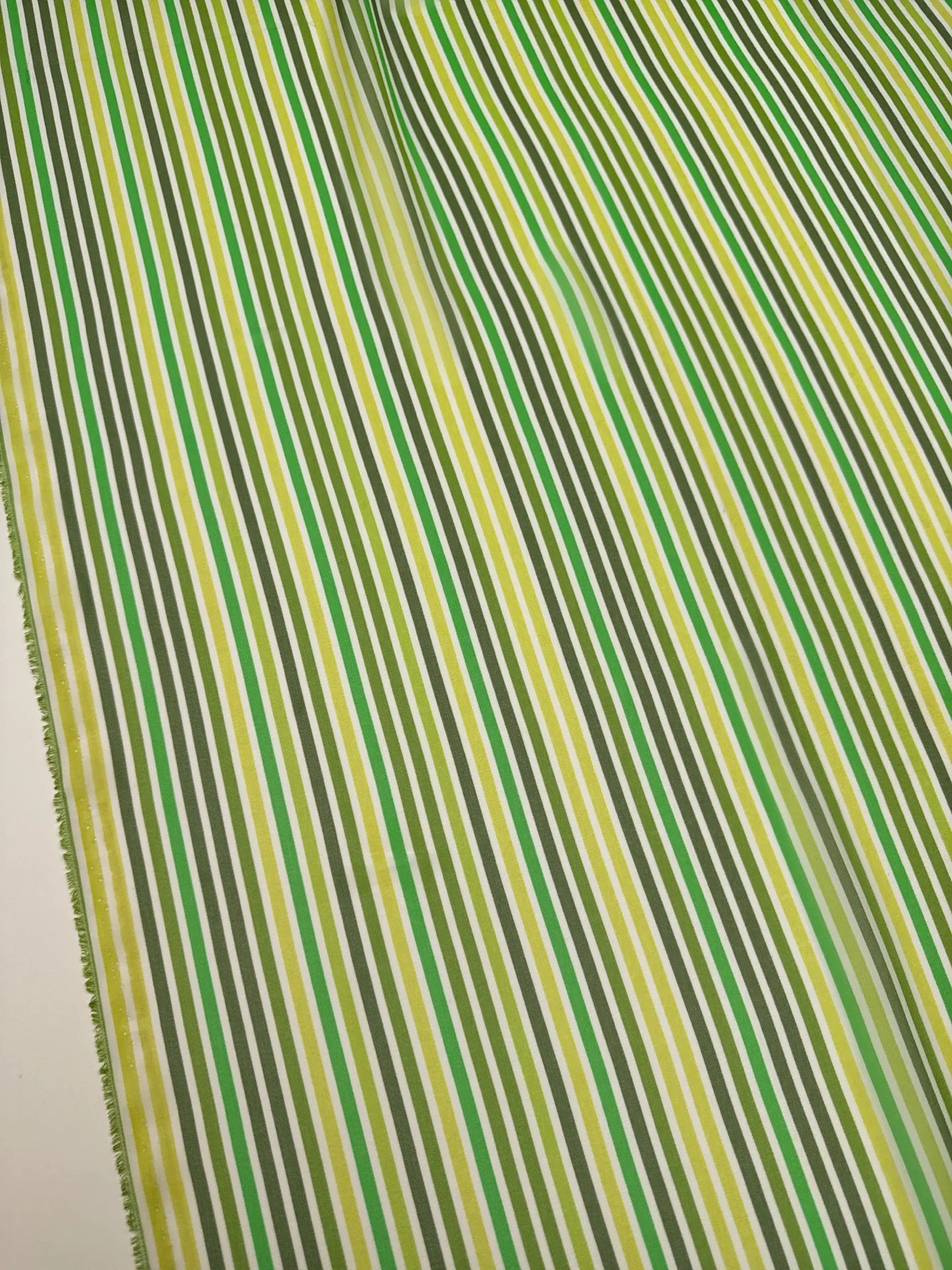 Image of Italian 100% silk crepe fabric with green stripes - available online at Charlotte's Fabrics
