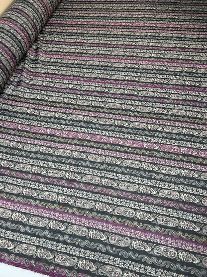 Image of Italian chiffon fabric with a black and purple paisley pattern and lurex thread – available online at Charlotte's Fabrics