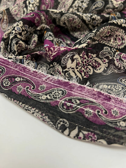 Image of Italian chiffon fabric with a black and purple paisley pattern and lurex thread, available online at Šarlotes audumi