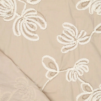 Image of embroidered cotton fabric with a floral pattern, natural tone, 150 g/m² – available at Šarlotes audumi