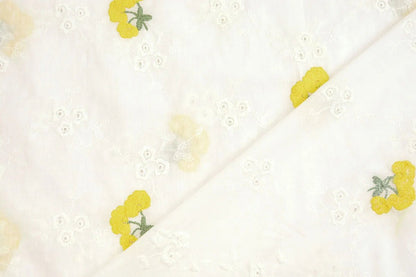 Tissu en coton brodé - fleurs jaunes 110 g/m²