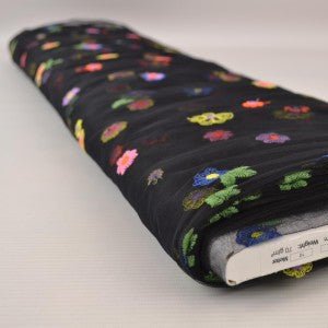 Image of embroidered tulle fabric with flowers - black tone 70 g/m² – available at Šarlotes audumi
